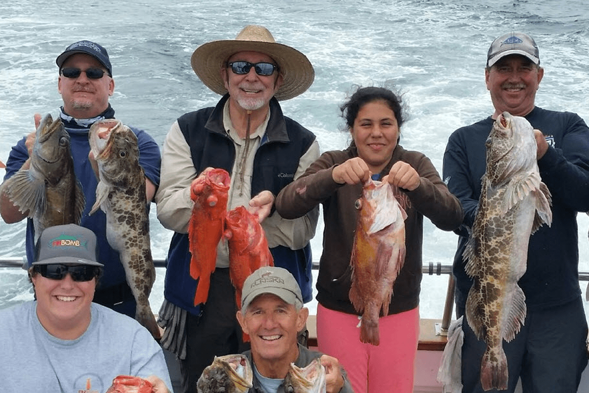 Smiling anglers with freshly caught fish