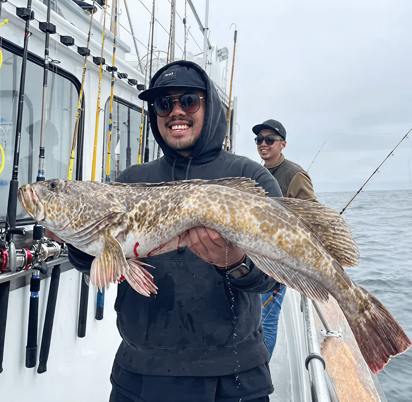 Smiling fisherman with his catch